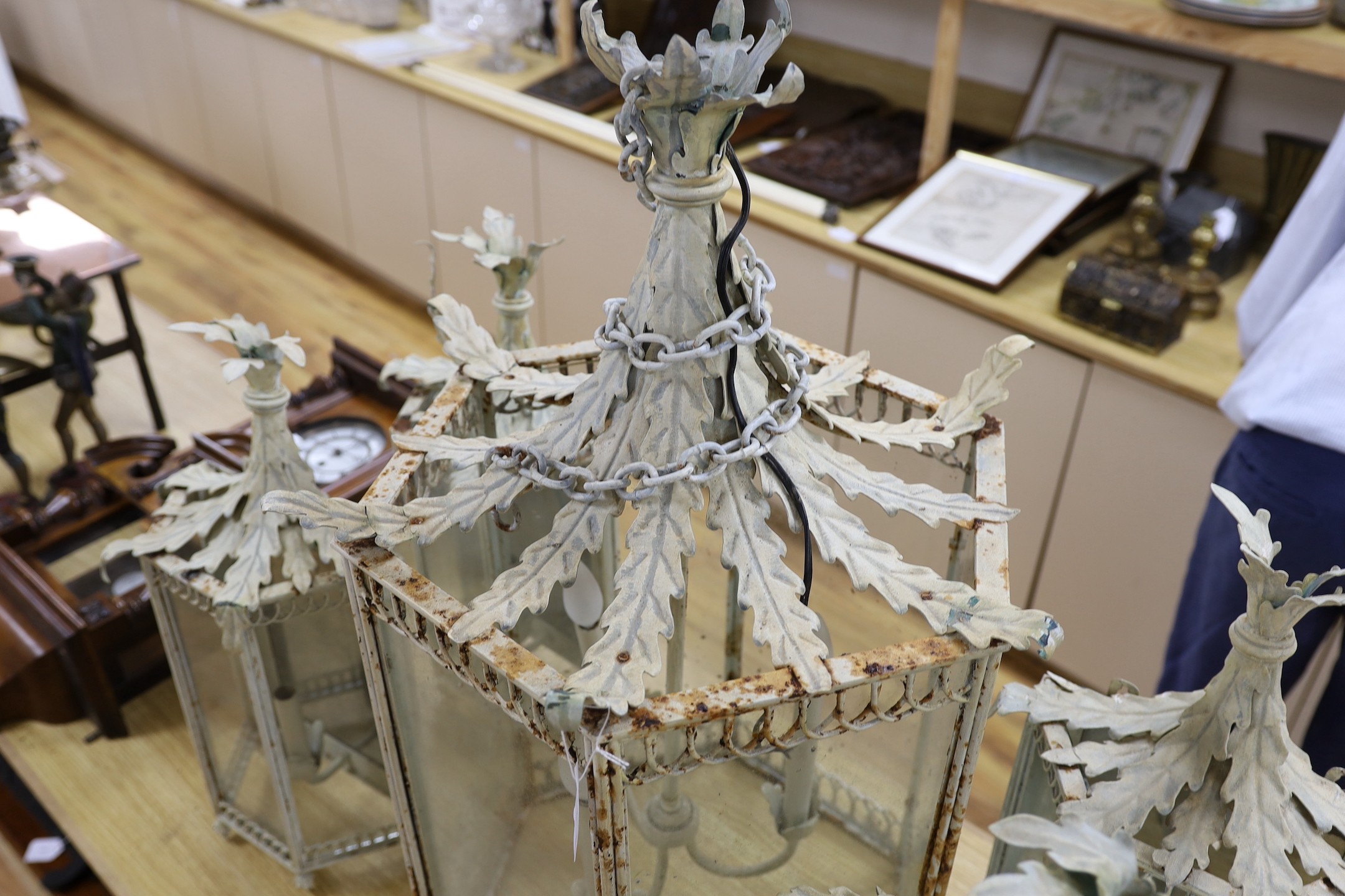 Thomas Messel - A large hexagonal painted hall lantern and a set of four matching wall lights, largest 81cm